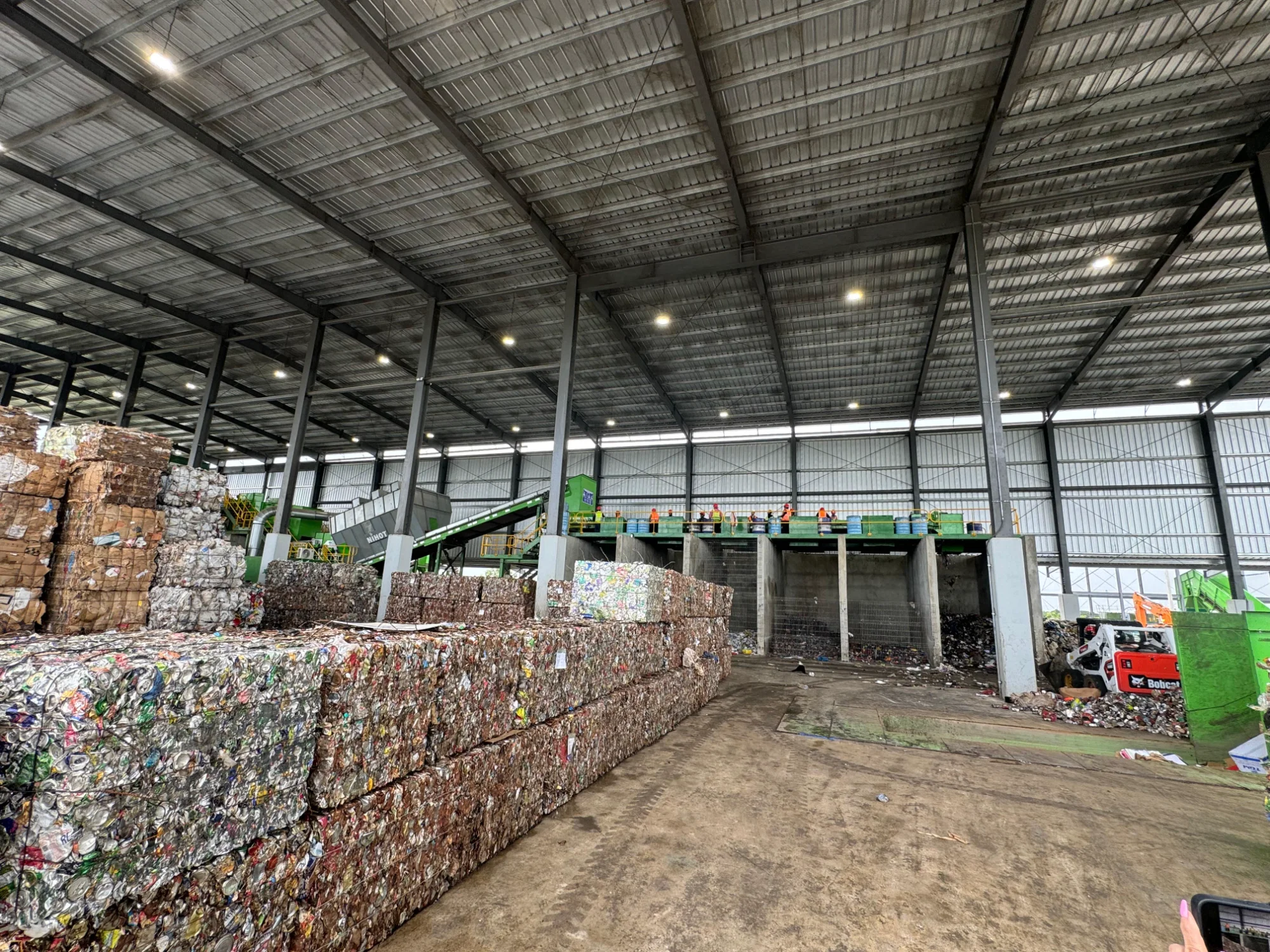 Baled recyclable materials in warehouse